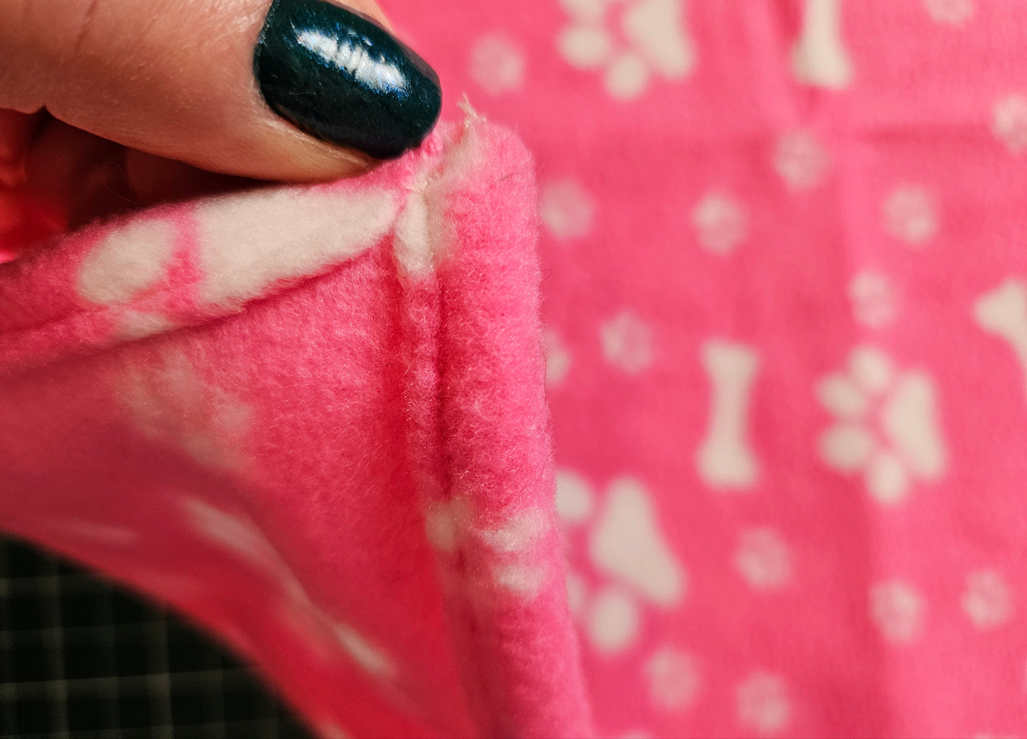 Little Pet Blanket. Dog theme Anti Pill Polar Fleece Fabric with paw and bones prints. Selection of pink or black background