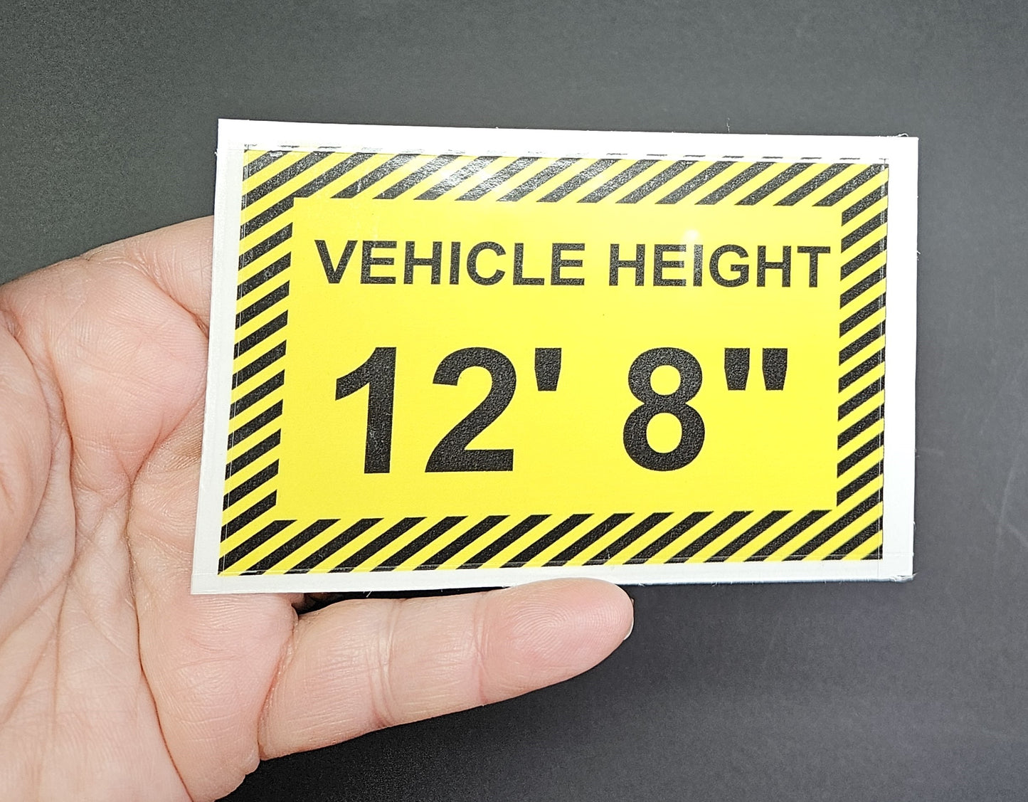 Commercial Vehicle Height Signs to place inside the cab of Commercial vehicles. White Vinyl or Transparent background & Laminated. Size 10 X 6.5 cm