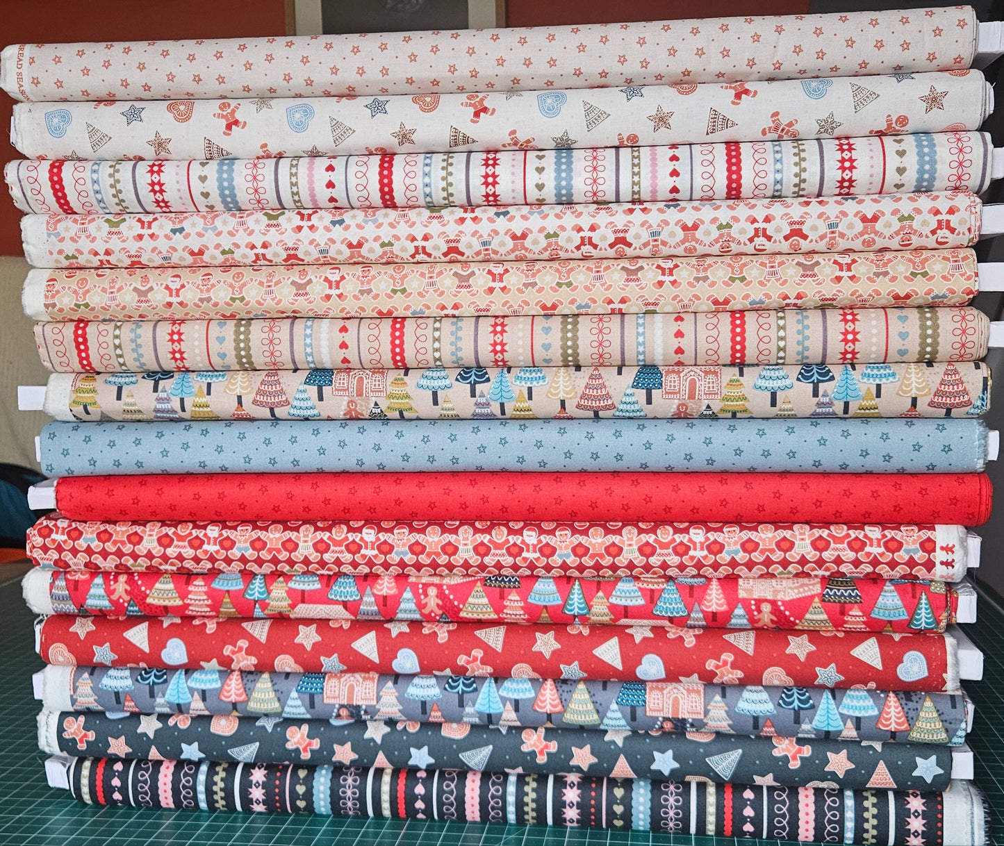 Gingerbread Stars on Red - Christmas Fabrics collection by Lewis & Irene