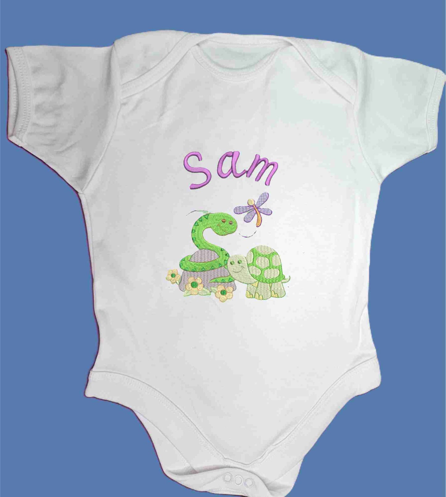 Personalised Baby Snake and Baby Turtle enjoying the spring with their little Dragonfly friend.  Design Embroidered on Organic Cotton Long and Short Sleeve Baby Bodysuit. Comfortable and soft.
