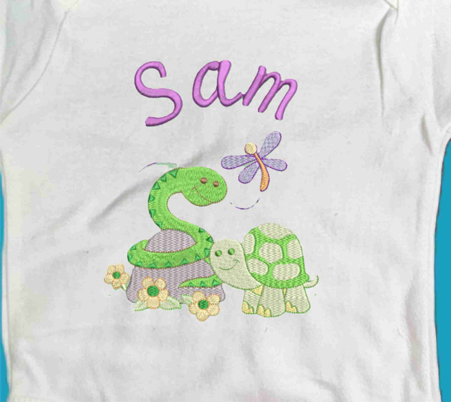 Personalised Baby Snake and Baby Turtle enjoying the spring with their little Dragonfly friend.  Design Embroidered on Organic Cotton Long and Short Sleeve Baby Bodysuit. Comfortable and soft.